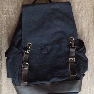 Full sized canvas backpack, genuine leather trim.
